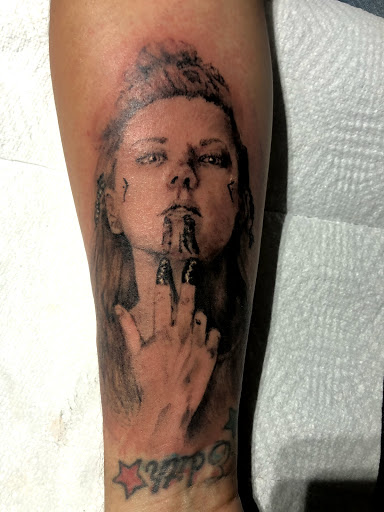 Explore we the people tattoo ideas, creative tattoo ideas in Brunswick, available at Brunswick Tattoo Company