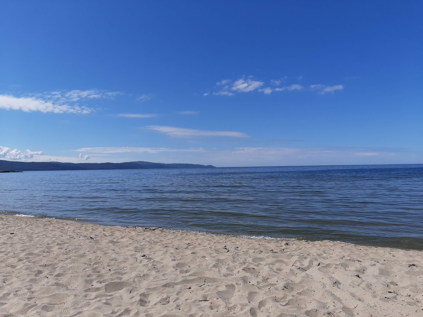 Foto van Sandy Beach gelegen in een natuurlijk gebied