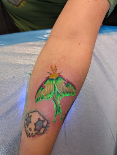 Explore red hand tattoo ideas, creative tattoo ideas in East Rochester, available at Spice City Tattoo