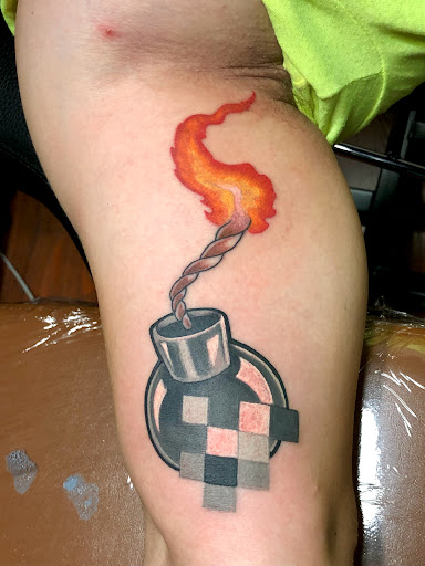 Find boob tattoo ideas for your next unique tattoo in Roseville at Fallen Angel Tattoo