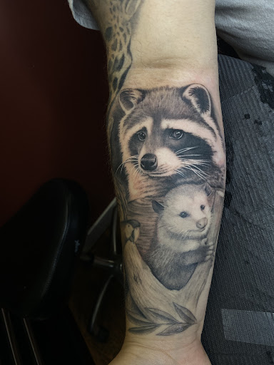 Explore black and grey tattoo ideas, creative tattoo ideas in West Point, available at Liquid Metal Tattoo & Body Piercing