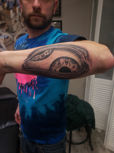 Explore mens behind the ear tattoo ideas, creative tattoo ideas in Linn Creek, available at Hillard Skillard Tattoos, LLC.