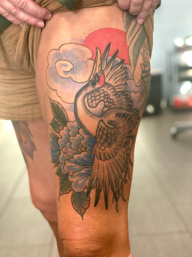 Explore sticker sleeve tattoo ideas, creative tattoo ideas in Palm Harbor, available at Angry Owl Tattoo and Piercing