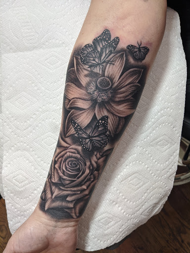Explore wildflower tattoo ideas, creative tattoo ideas in Little Rock, available at Love Spell Tattoo