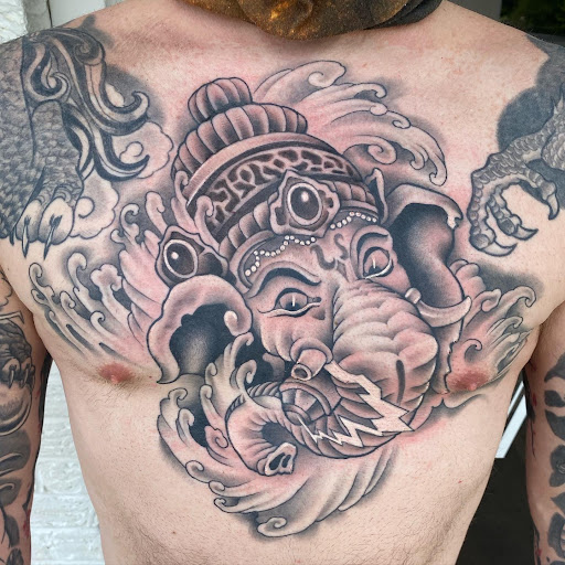 Explore charmander tattoo ideas, creative tattoo ideas in Erie, available at Wayward Tattoo Studio