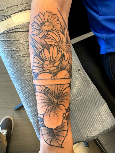 Find joker tattoo ideas for men for your next unique tattoo in Palm Harbor at Angry Owl Tattoo and Piercing