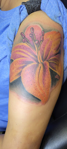 Explore tattoo ideas for names on wrist, creative tattoo ideas in Angola, available at Hoodlum Ink