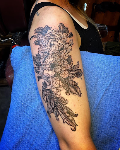 Explore water lily tattoo ideas, creative tattoo ideas in Moweaqua, available at Fleshwound Tattoo
