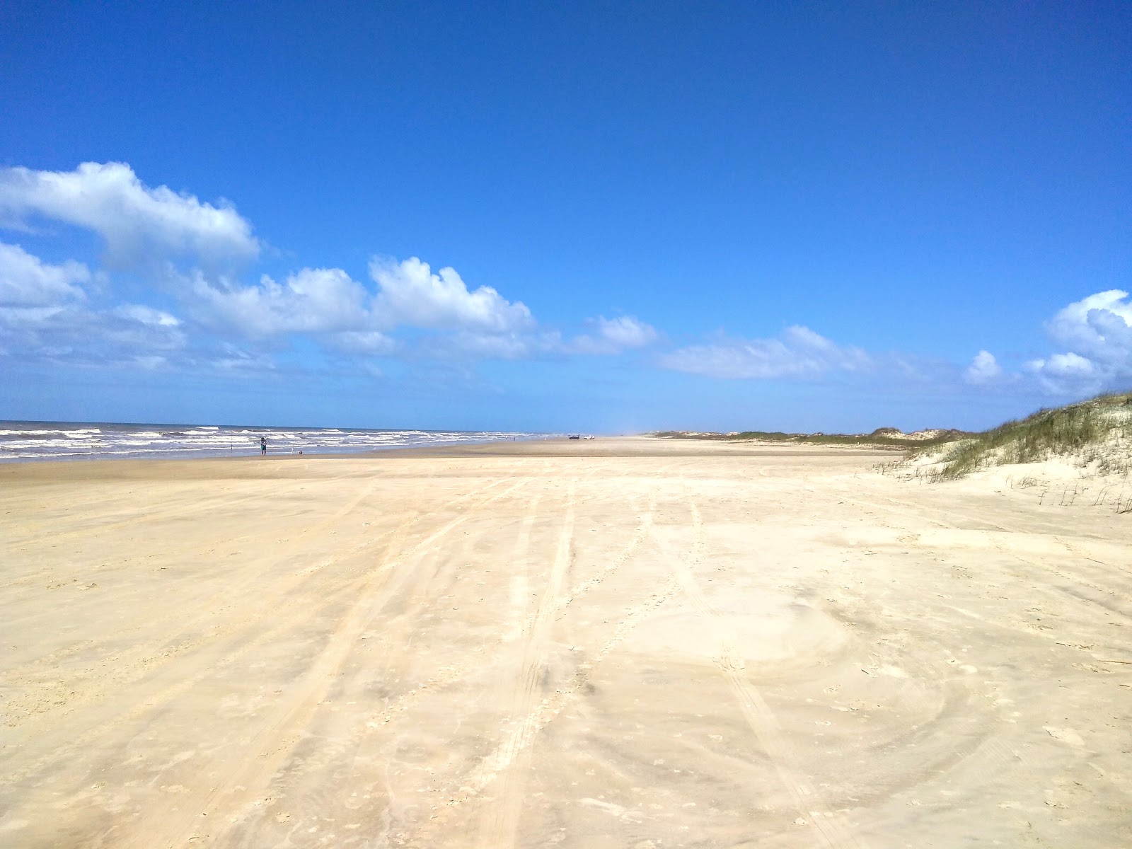 Foto de Playa Costa do Sol con arena beige superficie