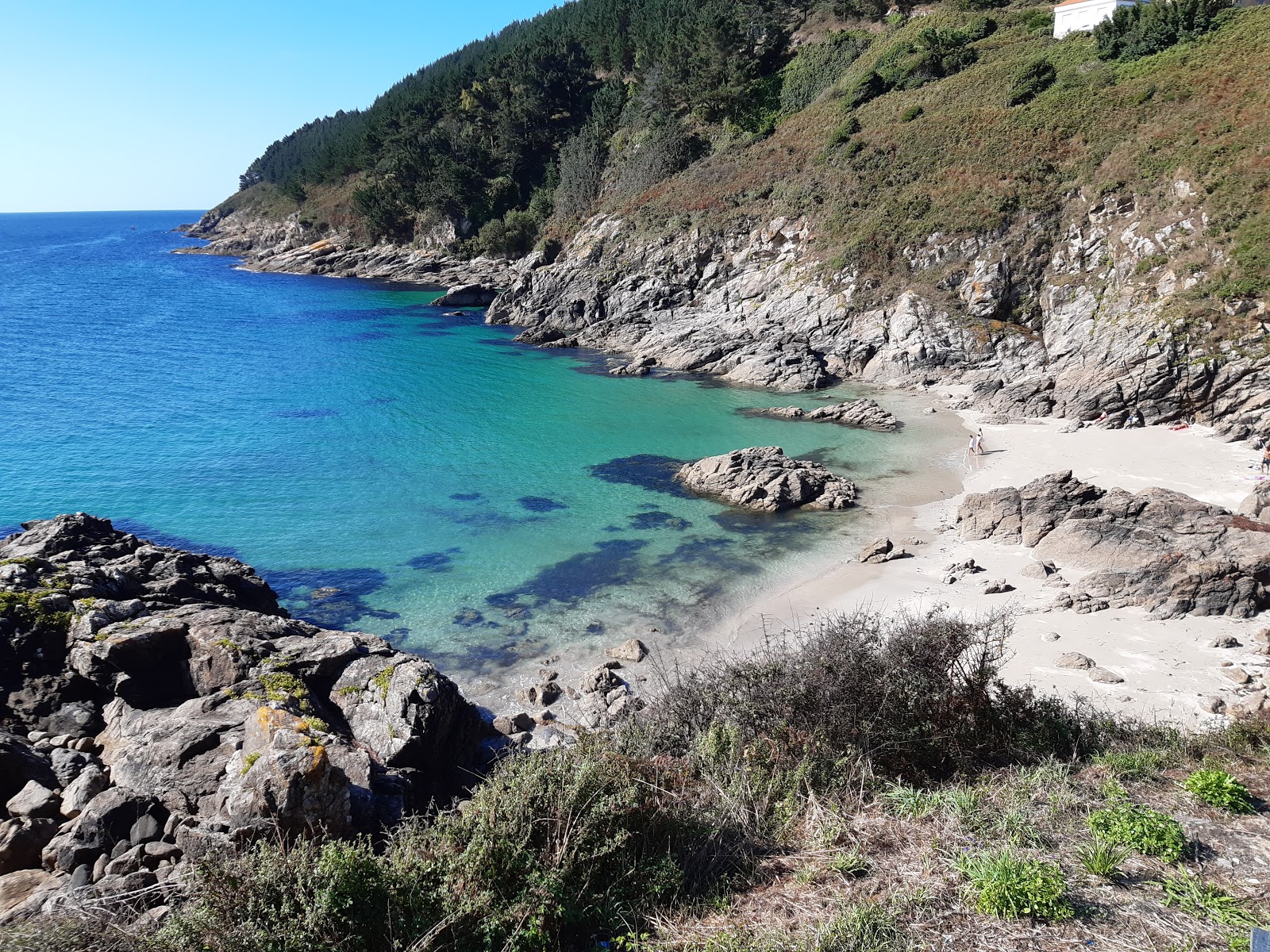 Fotografie cu Praia Corveiro cu o suprafață de nisip beige