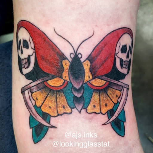 Explore rip tattoo ideas, creative tattoo ideas in Topeka, available at Looking Glass Tattoo & Gallery