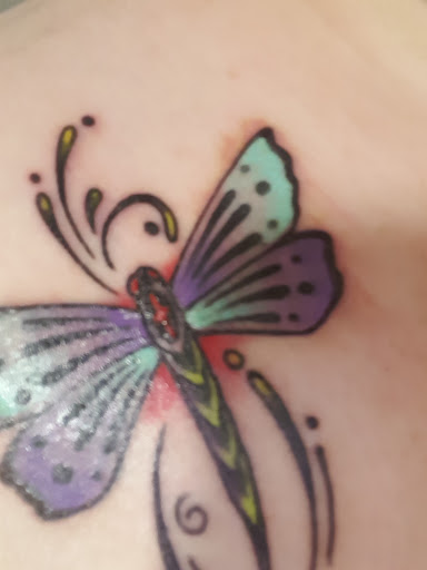 Explore behind neck tattoo ideas, creative tattoo ideas in Reno, available at Evolution Tattoo