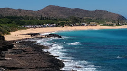 Sandy Beach'in fotoğrafı uçurumlarla desteklenmiş