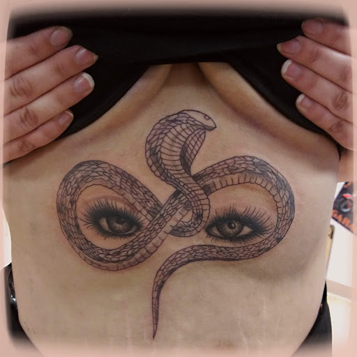 Explore neck tattoos for men ideas, creative tattoo ideas in La Crosse, available at La Crosse Tattoo