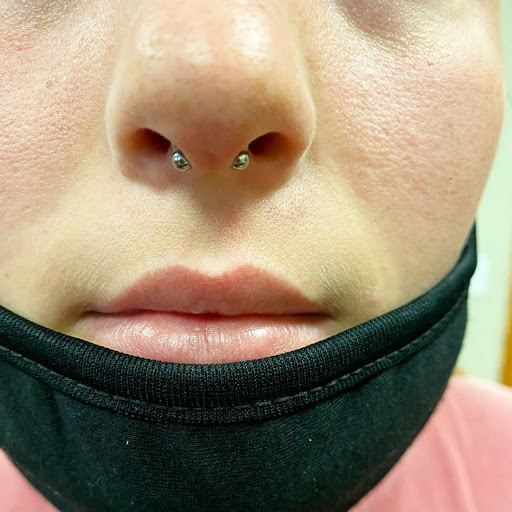 Find in between boob tattoo ideas for your next unique tattoo in Summerville at Exotic Impressions Body Piercing