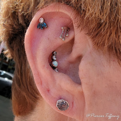 Explore cover up star tattoo ideas, creative tattoo ideas in Somerville, available at Piercings by Tiffany at Artisanal Tattoo