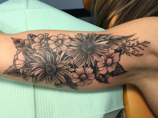Find arm half sleeve tattoo ideas for your next unique tattoo in Brunswick at Blue Fin Tattoos