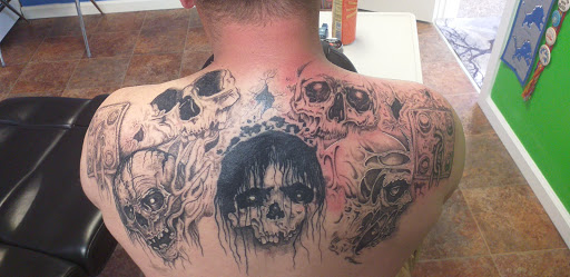 Explore wrist cross tattoo ideas, creative tattoo ideas in Calumet, available at Tattoos by Norm