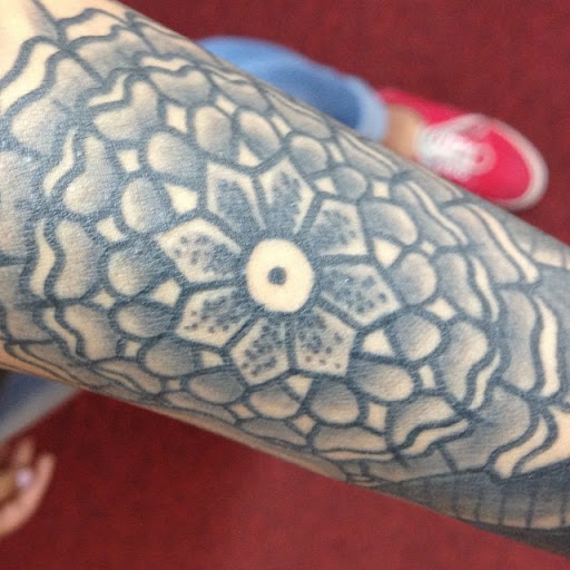 Explore zodiac tattoo ideas for men, creative tattoo ideas in Tucson, available at Enchanted Dragon