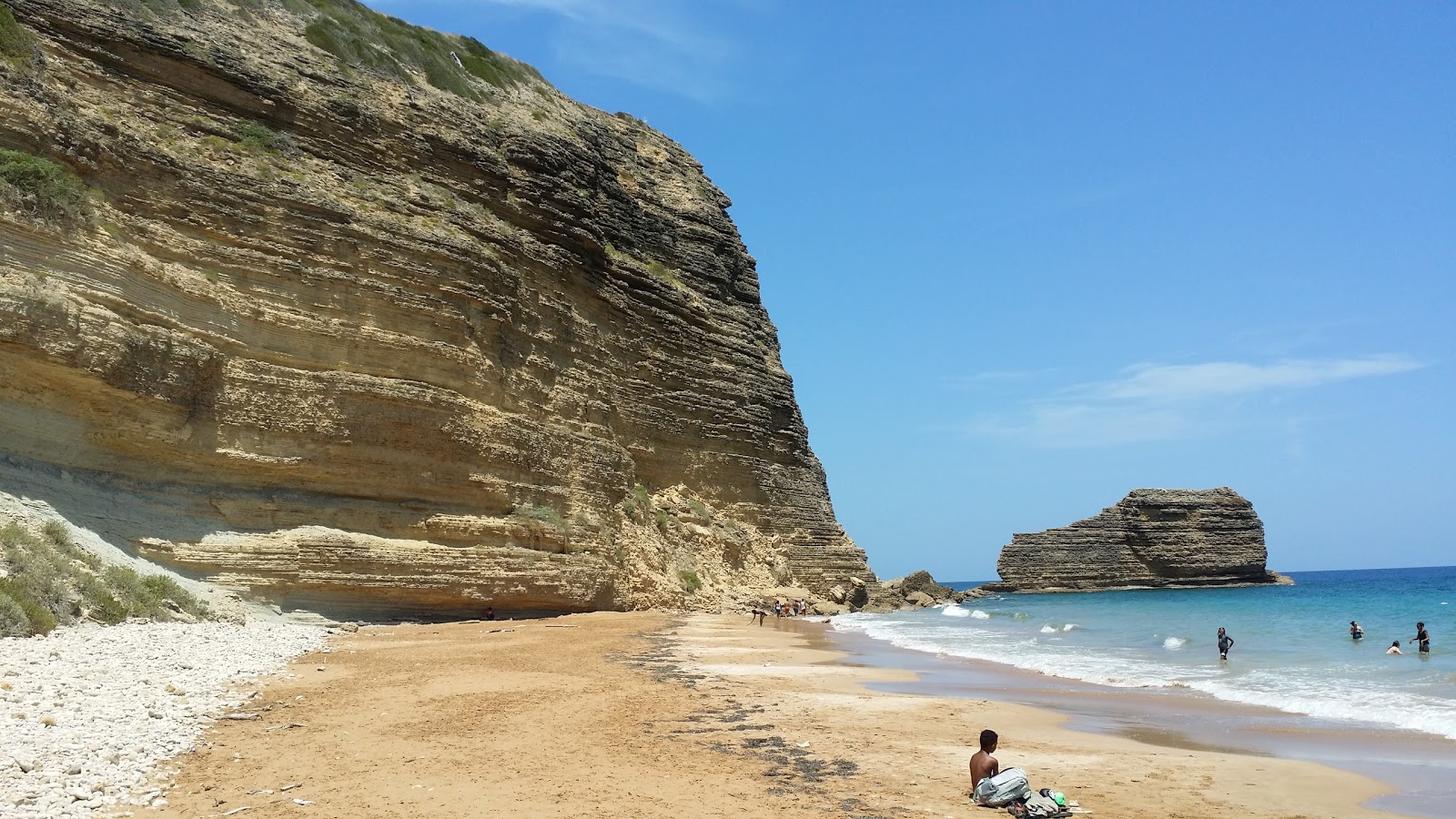Foto van Playa El Morro met beige zand en kiezels oppervlakte