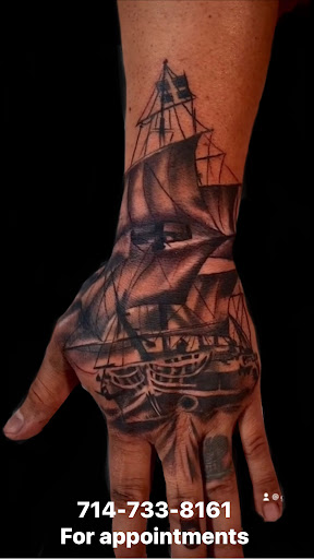 Find in between breast tattoo ideas for your next unique tattoo in Orange at Ink Activitiez Tattoo