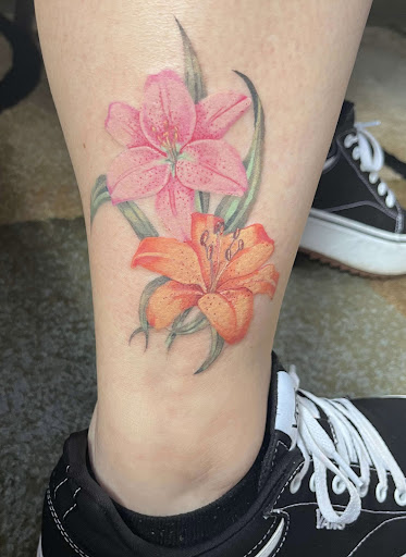 Explore tramp stamp cover up tattoo ideas, creative tattoo ideas in Clarksville, available at Uncle Bobs Tattoos