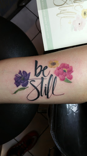 Explore flower tattoo ideas for men, creative tattoo ideas in Foley, available at Black Sheep Custom Tattoos and Piercings