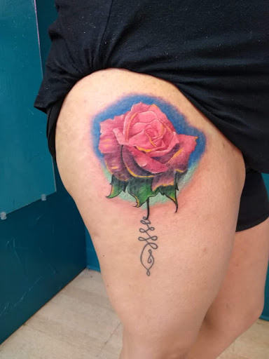 Explore hand tattoo ideas for females, creative tattoo ideas in Hereford, available at Slow Pain Tattoo Body Art Studio