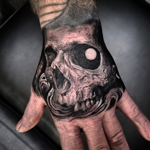 Explore tattoo ideas on ribs for men, creative tattoo ideas in Dubuque, available at Grim River Tattoo