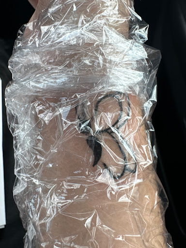 Explore name cover up tattoo ideas, creative tattoo ideas in Seymour, available at American Gypsy Tattoo Corp.