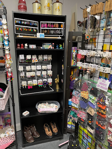 Explore female tattoo ideas for lower back, creative tattoo ideas in Louisburg, available at Purple Dot Piercings