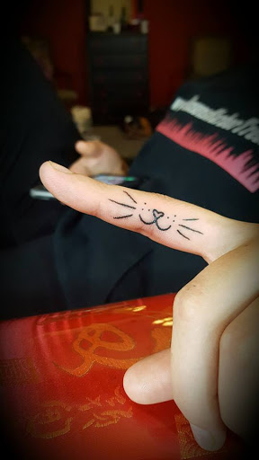 Explore cross stitch tattoo ideas, creative tattoo ideas in Hood River, available at Hood River Tattoo