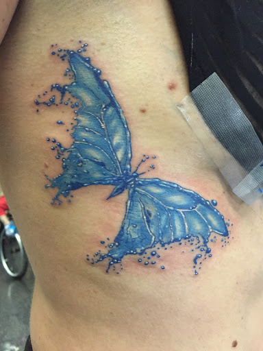 Explore street signs tattoo ideas, creative tattoo ideas in Overland Park, available at Aftershock Tattoo Co.
