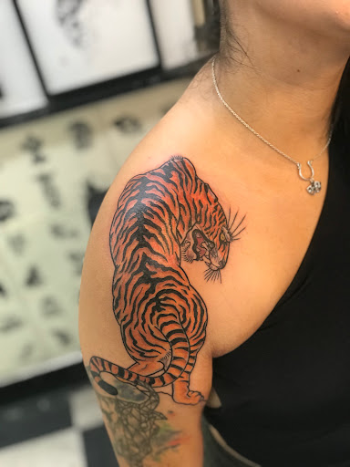 Explore july birth flower tattoo ideas, creative tattoo ideas in San Marcos, available at Jerrys Tattoo Shop