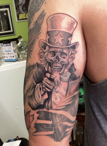 Explore american sleeve tattoo ideas, creative tattoo ideas in Marietta, available at Monkeys Uncle Tattoo