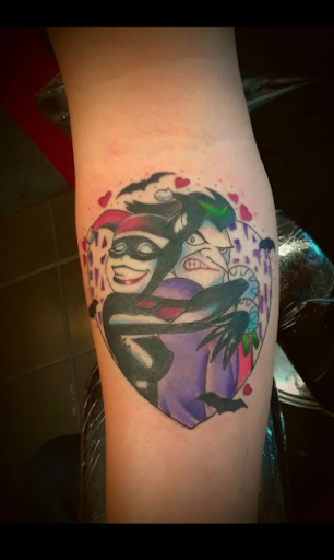 Explore purple flower tattoo ideas, creative tattoo ideas in Searcy, available at Eternal Art Tattoo Studio lc
