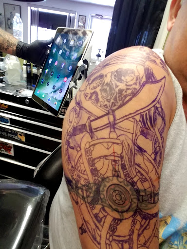 Explore chrysanthemum tattoo november birth flower tattoo ideas, creative tattoo ideas in Pinellas Park, available at Lollis Studios Tattoo Company