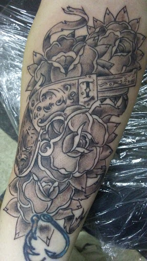 Explore black cover up tattoo ideas, creative tattoo ideas in Russellville, available at BG Tattoos