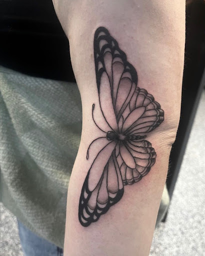 Explore spine tattoo ideas for females, creative tattoo ideas in Monroe, available at Skin City Tattoo Studio