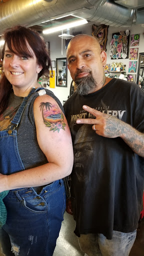 Explore mental health ribbon tattoo ideas, creative tattoo ideas in Colorado Springs, available at Fallen Heroes Tattoo & Piercing (Colorado)