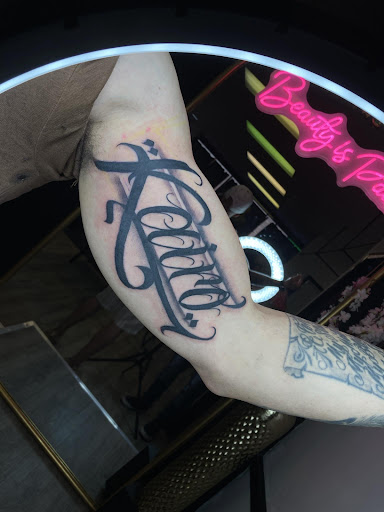 Explore country music tattoo ideas, creative tattoo ideas in Milwaukee, available at Beauty is Pain Tattoo and Body Piercings