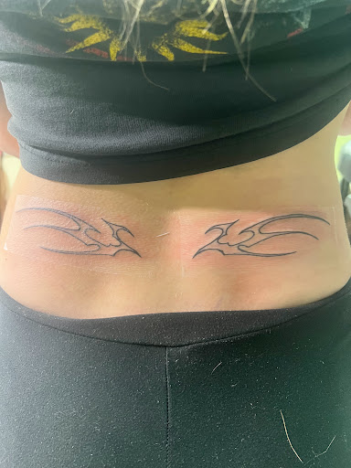 Explore hand tattoo ideas for woman, creative tattoo ideas in Alfred, available at Tattooed Spirit