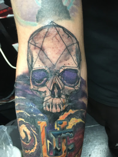Explore mens dark tattoo ideas, creative tattoo ideas in Largo, available at Alchemy Tattoos and Body Piercings