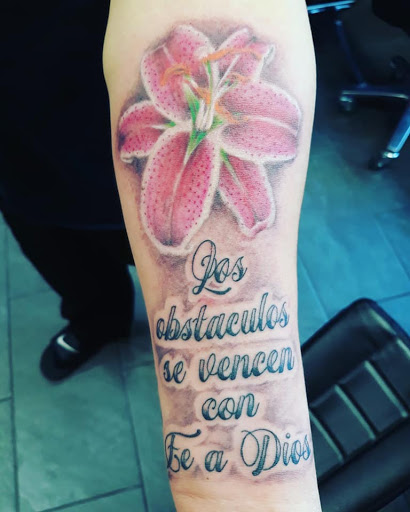 Explore upper arm tattoo ideas for guys, creative tattoo ideas in Brentwood, available at Ink Addiction