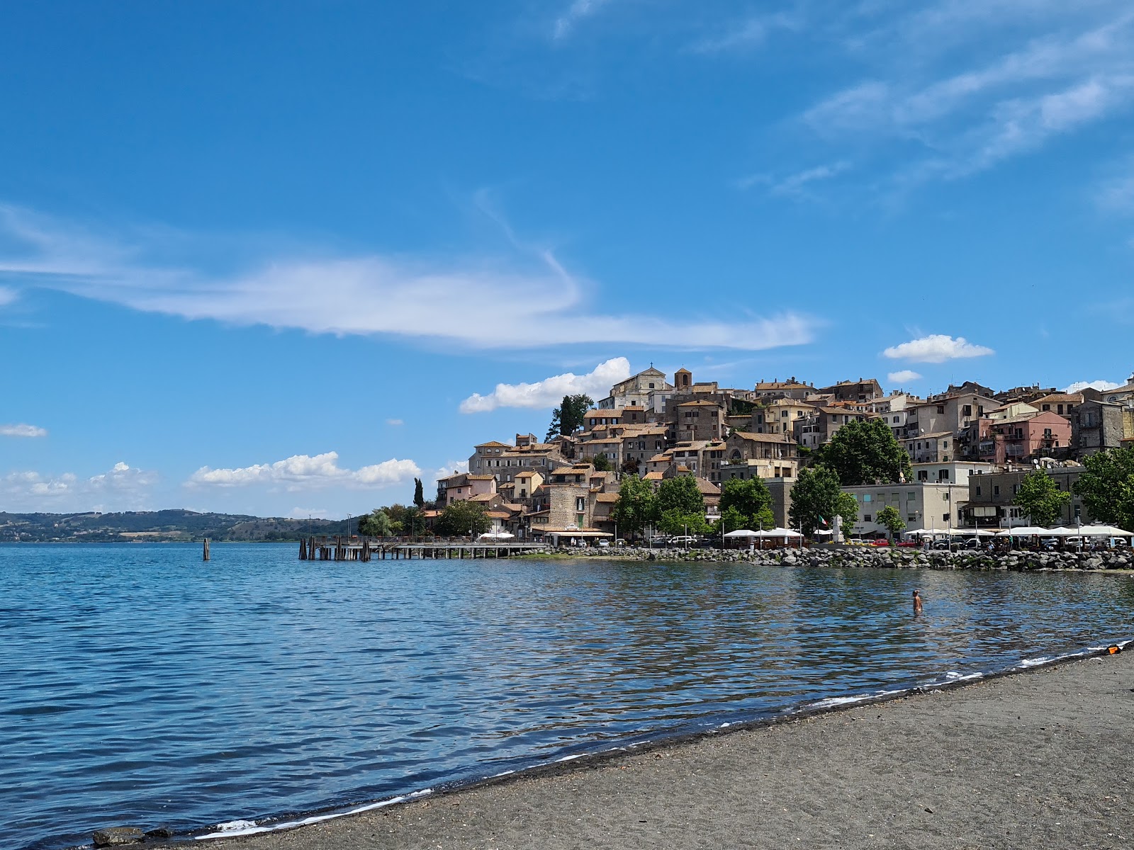 Foto av Stranden Lido Dei Cigni med turkos rent vatten yta