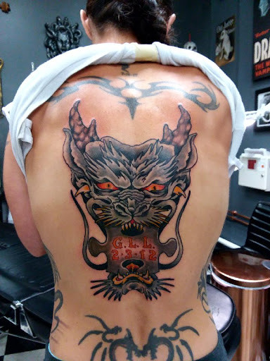 Explore justice tattoo ideas, creative tattoo ideas in Stevens Point, available at Black Rabbit Tattooing