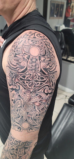 Find sword tattoo ideas for your next unique tattoo in Ocoee at Slaughterized Ink Tattoo and Piercing Studio