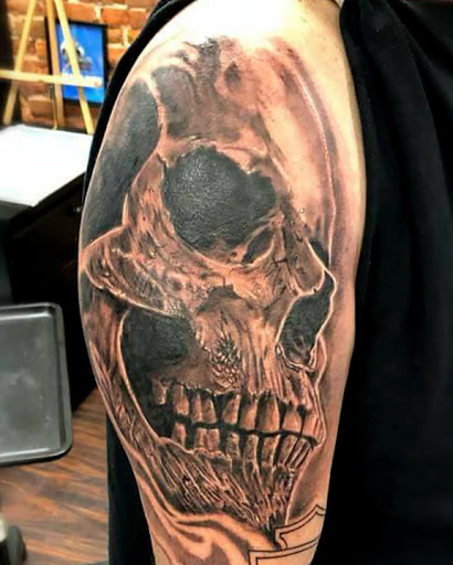 Explore black and white sleeve tattoo ideas, creative tattoo ideas in Dubuque, available at The Crows Nest