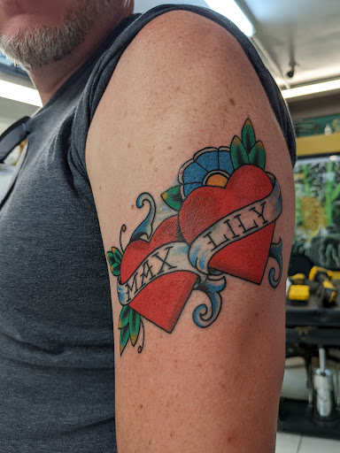 Explore forearm dragon tattoo ideas, creative tattoo ideas in Honolulu, available at Sacred Art Tattoo Waikiki