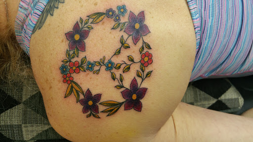 Explore safety pin tattoo ideas, creative tattoo ideas in Harrison, available at West Hudson Tattoo